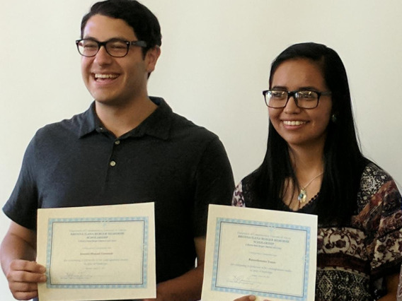 Students posing for a photo with their certificates.